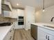 Well-equipped kitchen with stainless steel appliances and stylish backsplash at 17025 Malone Ln, Mint Hill, NC 28227
