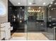 Modern bathroom showcasing a glass shower, black tile, and gold accents at 18432 Harbor Light Blvd, Cornelius, NC 28031