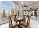 Bright dining area with checkerboard table, large windows, and scenic lake views at 18432 Harbor Light Blvd, Cornelius, NC 28031