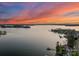 Breathtaking aerial view of the lake with serene waters and picturesque shoreline properties at 18432 Harbor Light Blvd, Cornelius, NC 28031