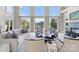 Bright living room with floor-to-ceiling windows and lake views at 18432 Harbor Light Blvd, Cornelius, NC 28031