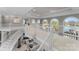 Spacious loft with multiple seating areas and large windows overlooking the water at 18432 Harbor Light Blvd, Cornelius, NC 28031