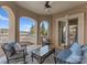 Covered patio featuring comfortable seating with beautiful lake views at 18432 Harbor Light Blvd, Cornelius, NC 28031