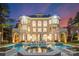 Stunning backyard pool with a hot tub, lounge seating, and classic architecture in a beautiful waterfront home at 18432 Harbor Light Blvd, Cornelius, NC 28031