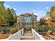 Sprawling rear facade of the home with luxurious in-ground pool, grassy lawn, and mature landscaping at 18432 Harbor Light Blvd, Cornelius, NC 28031
