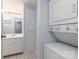 Bathroom with a white vanity, stacked washer/dryer unit, and a storage cabinet at 211 Heritage Blvd # 108, Fort Mill, SC 29715