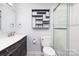 Tastefully decorated bathroom with modern shelving, vanity, and glass-enclosed shower at 211 Heritage Blvd # 108, Fort Mill, SC 29715