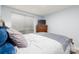 Bedroom with a wooden dresser and a window with blinds, featuring a blue and gray color scheme at 211 Heritage Blvd # 108, Fort Mill, SC 29715
