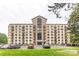 Expansive exterior view of condo building featuring a brick facade, multiple stories, and convenient parking at 211 Heritage Blvd # 108, Fort Mill, SC 29715