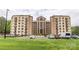 Exterior view of condo building with brick facade, multiple stories and convenient parking at 211 Heritage Blvd # 108, Fort Mill, SC 29715