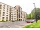 Exterior view of condo building with brick facade, multiple stories and convenient parking at 211 Heritage Blvd # 108, Fort Mill, SC 29715