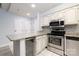Kitchen featuring white cabinets, stainless steel appliances, granite countertops, and a beverage cooler at 211 Heritage Blvd # 108, Fort Mill, SC 29715