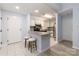 A well lit kitchen with white cabinets, granite countertops and stainless steel appliances at 211 Heritage Blvd # 108, Fort Mill, SC 29715