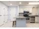 Kitchen with granite countertops, stainless steel appliances, and a breakfast bar with seating for two at 211 Heritage Blvd # 108, Fort Mill, SC 29715