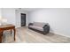 Living room with light-colored floors, a gray couch, and a wooden desk with lamp at 211 Heritage Blvd # 108, Fort Mill, SC 29715