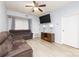 Inviting living room featuring a ceiling fan, vinyl floors, neutral paint and comfortable sofa at 211 Heritage Blvd # 108, Fort Mill, SC 29715