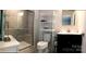 Bathroom featuring walk-in shower, vanity, mirror, toilet and shelving unit at 247 Damask Dr, Lancaster, SC 29720