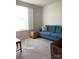 Bright bedroom featuring ample natural light and a comfortable blue couch at 247 Damask Dr, Lancaster, SC 29720