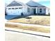 Charming single-story home showcasing a two-car garage and well-maintained front lawn at 247 Damask Dr, Lancaster, SC 29720