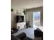 Bright living room featuring shuttered sliding glass door to the backyard at 247 Damask Dr, Lancaster, SC 29720