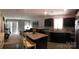 Open-concept living room with comfortable seating and kitchen in the background at 247 Damask Dr, Lancaster, SC 29720