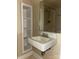 Bathroom featuring a sink, mirror, shower, and built-in shelving unit for storage at 3045 Woodleaf Rd, Salisbury, NC 28147
