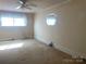Cozy bedroom with two windows and overhead ceiling fan at 3045 Woodleaf Rd, Salisbury, NC 28147