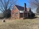 Charming brick home with a cozy front porch and a classic chimney at 3045 Woodleaf Rd, Salisbury, NC 28147