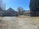 Image shows exterior view of a detached building with a dirt parking lot at 3045 Woodleaf Rd, Salisbury, NC 28147