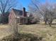 Traditional brick house with a chimney and a covered front porch at 3045 Woodleaf Rd, Salisbury, NC 28147