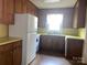 A kitchen featuring wood cabinets and modern white appliances at 3045 Woodleaf Rd, Salisbury, NC 28147