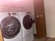 Laundry room featuring two modern white washing machines at 3045 Woodleaf Rd, Salisbury, NC 28147