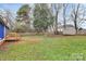 A grassy backyard with a shed and a wooden fence behind a house at 333 S Eastway Dr, Troutman, NC 28166