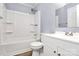 This updated bathroom features a tub/shower, white fixtures and modern finishes at 333 S Eastway Dr, Troutman, NC 28166