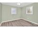 A relaxing bedroom with neutral paint, ceiling fan and hardwood floors is move-in ready at 333 S Eastway Dr, Troutman, NC 28166