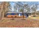 Charming home with a blue exterior, red brick, screened in porch, and spacious front yard at 333 S Eastway Dr, Troutman, NC 28166