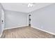 Bright living room with luxury vinyl flooring, neutral walls, new ceiling fan, and abundant natural light at 333 S Eastway Dr, Troutman, NC 28166