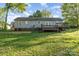 View of the backyard and deck, providing an inviting outdoor space for relaxation and enjoyment at 341 Cline Dr, Salisbury, NC 28146