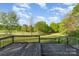 A wooden deck overlooking the expansive and well-manicured backyard at 341 Cline Dr, Salisbury, NC 28146