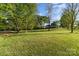 Expansive yard with mature trees, offers a serene and private outdoor space at 341 Cline Dr, Salisbury, NC 28146