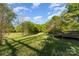 Expansive backyard features lush green grass and a spacious wooden deck, perfect for outdoor enjoyment at 341 Cline Dr, Salisbury, NC 28146