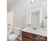 Modest bathroom with a combined tub and shower, vanity, and mirror at 341 Cline Dr, Salisbury, NC 28146