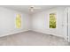 Comfortable bedroom with neutral carpet, ceiling fan, and natural light from windows at 341 Cline Dr, Salisbury, NC 28146