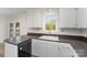 A view of the kitchen sink and cabinets plus french doors to the exterior at 341 Cline Dr, Salisbury, NC 28146