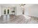 Spacious living room with light gray floors, neutral walls, and French doors leading to an outdoor deck at 341 Cline Dr, Salisbury, NC 28146