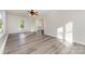 Bright living room featuring hardwood floors, ceiling fan, and multiple windows at 341 Cline Dr, Salisbury, NC 28146