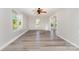 Light-filled living room with light gray vinyl floors, neutral paint, and multiple windows offering a bright, inviting space at 341 Cline Dr, Salisbury, NC 28146
