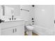 This bathroom features modern fixtures, a shower-tub combo, and a white vanity at 3808 Odom Way, Charlotte, NC 28216