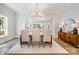 Elegant dining room with a modern chandelier, neutral decor, and sophisticated furnishings at 4004 Nettie Ct # 1, Charlotte, NC 28211