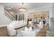 Stylish living room showcases a staircase, open layout, and comfortable seating arrangement at 4004 Nettie Ct # 1, Charlotte, NC 28211